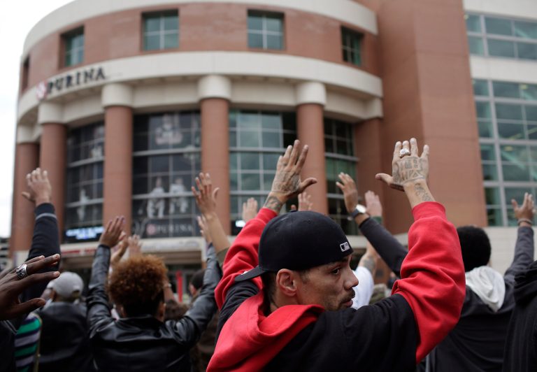 Demonstrators protest the shooting death of Michael Brown outside the Edward Jones Dome in St. Louis. (Joshua Lott/Getty images)
