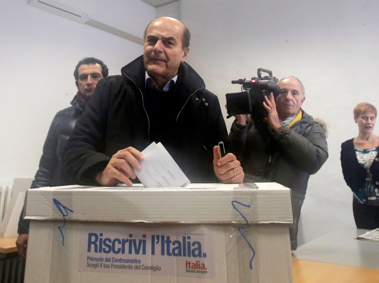   Pier Luigi Bersani, leader of the center-left Democratic Party, casts his vote during a primary runoff, in Piacenza, Italy, Sunday, Dec. 2, 2012. Italians are choosing a center-left candidate for premier for elections early next year, an important primary runoff given the main party is ahead in the polls against a center-right camp in utter chaos over whether Silvio Berlusconi will run again. Sunday's runoff pits veteran center-left leader Pier Luigi Bersani, 61, against the 37-year-old mayor of Florence, Matteo Renzi, not shown, who has campaigned on an Obama-style 