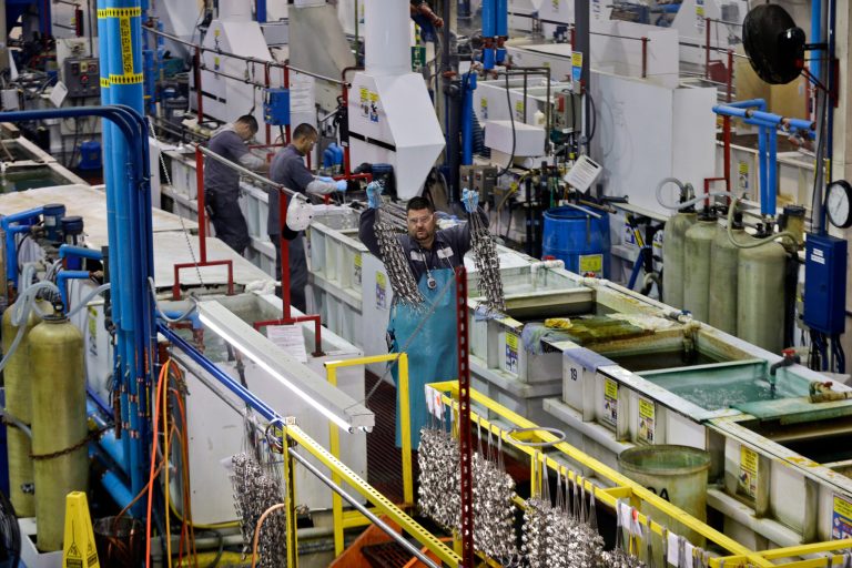 FILE - In this Thursday, Oct. 10, 2013, file photo, employees at Sheffield Platers Inc. work on the factory floor in San Diego.  The Commerce Department estimates U.S. company productivity and costs for the October-December quarter on Thursday, Feb. 6, 2014. (AP Photo/Lenny Ignelzi, File)