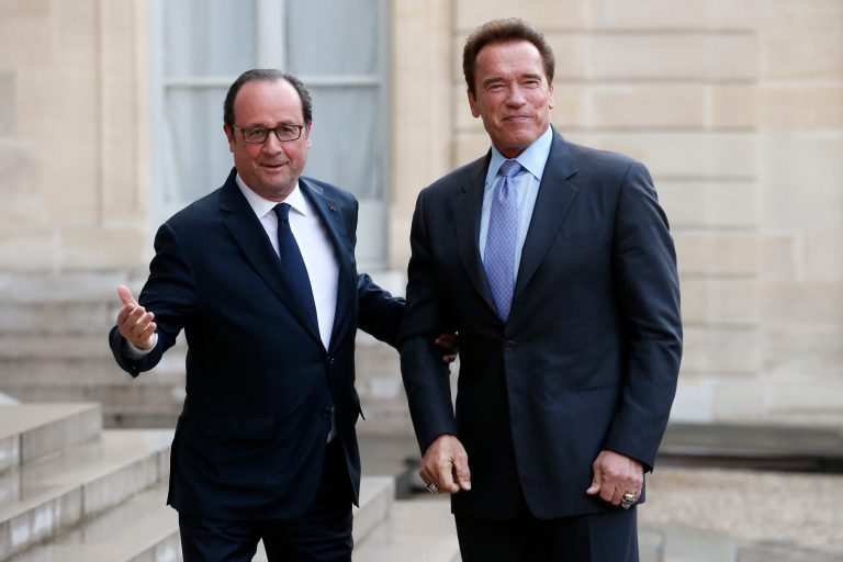 Arnold Schwarzenegger said environmental leadership will now fall to the state and local level, where, he said, 70 percent of emissions can be controlled. Former French President Francois Hollande welcomes Schwarzenegger before their meeting at the Elysee Palace in Paris in April. (AP Photo/Francois Mori)