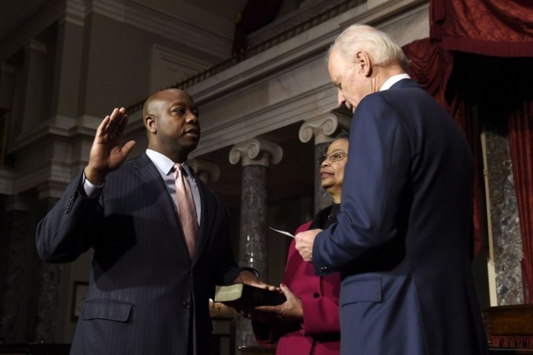 Vice President Joe Biden administers the ceremonial Senate oath to Sen. Tim Scott, R-S.C., as his mother Frances Scott holds the bible. (AP Photo/Susan Walsh)