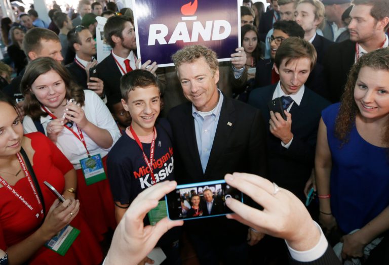 Republican presidential candidate Sen. Rand Paul, R-Ky., poses for photos before addressing the 2016 Mackinac Republican Leadership Conference, Saturday, Sept. 19, 2015, in Mackinac Island, Mich. (AP Photo/Carlos Osorio)