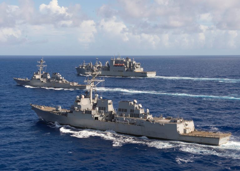 One defense expert predicts that the Donald Trump administration will build more Arleigh Burke-class destroyers, such as the USS Spruance, front, and the USS Decatur, left.