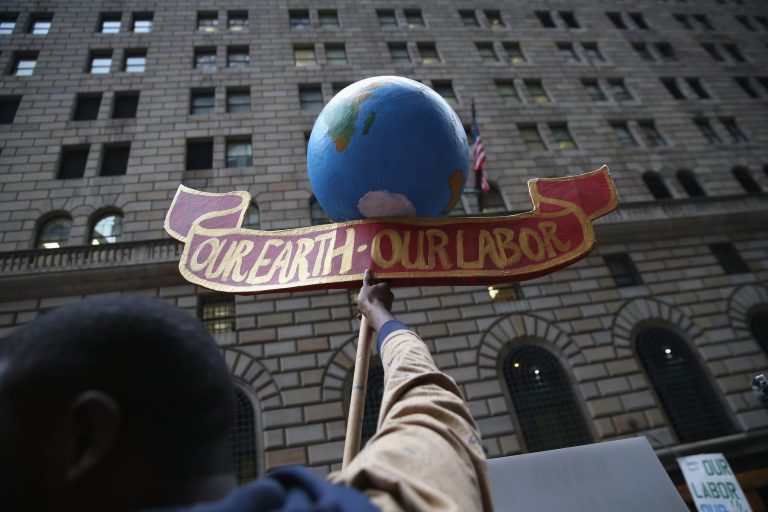 Environmental activists march on Earth Day on April 22, 2014 in New York City. (Photo by John Moore/Getty images)