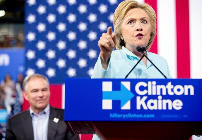 On Saturday, at her first rally since choosing Sen. Tim Kaine, D-Va., as her running mate, Clinton claimed that Donald Trump's running mate, Indiana Gov. Mike Pence, "slashed education funding." (AP Photo/Andrew Harnik)