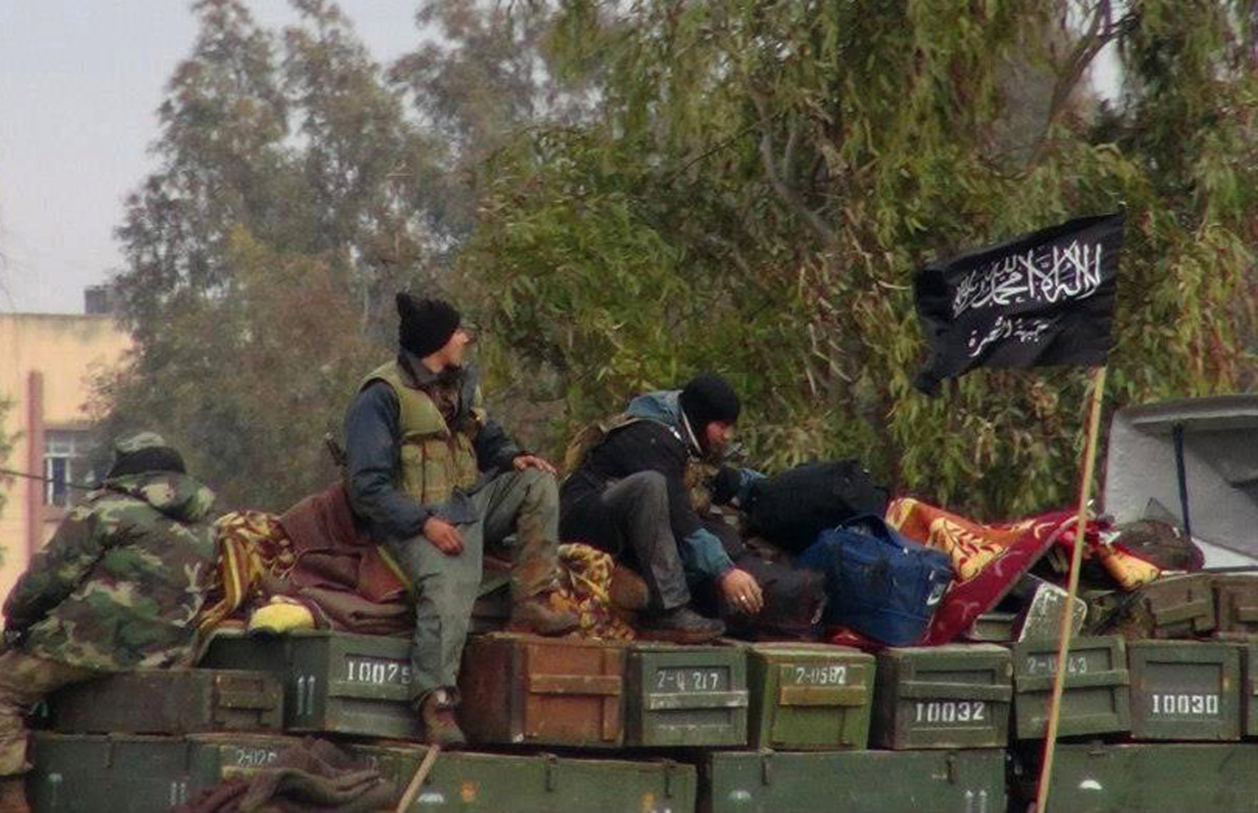 Syrian militant group unites with al-Qaida in Iraq
