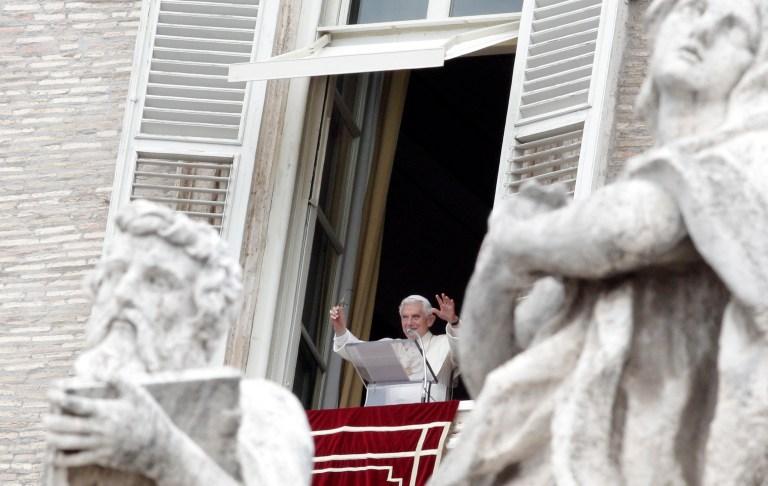   Pope Benedict XVI waves to the crowd from his studio's window overlooking St. Peter's square during the Angelus prayer at the Vatican, Sunday, June 10, 2012. (AP Photo/Riccardo De Luca)  