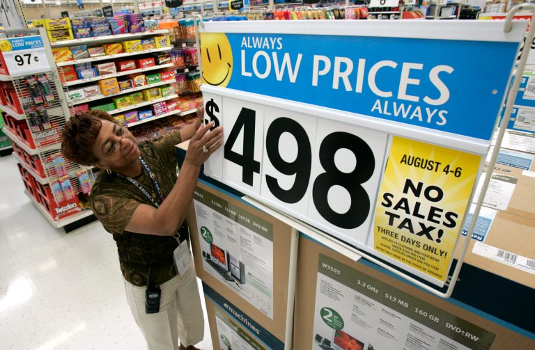According to Payscale.com, Walmart's cashiers on average make between $7.50 and $10.77 and sales associates make between $7.63 and $11.83. (AP File)