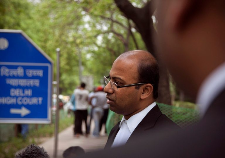 FILE - In this Thursday, April 17, 2014 file photo, Samarjeet Pattnaik, attorney of a New York City police officer Manny Encarnacion, speaks to the media in New Delhi, India. A court in India's capital has dropped a weapons charge against the New York City police officer and is allowing him to leave the country, his lawyer said Saturday. Encarnacion was arrested in March while visiting his wife in New Delhi after Indian airport authorities discovered three bullets he had accidentally packed in his luggage. (AP Photo/Tsering Topgyal, File)