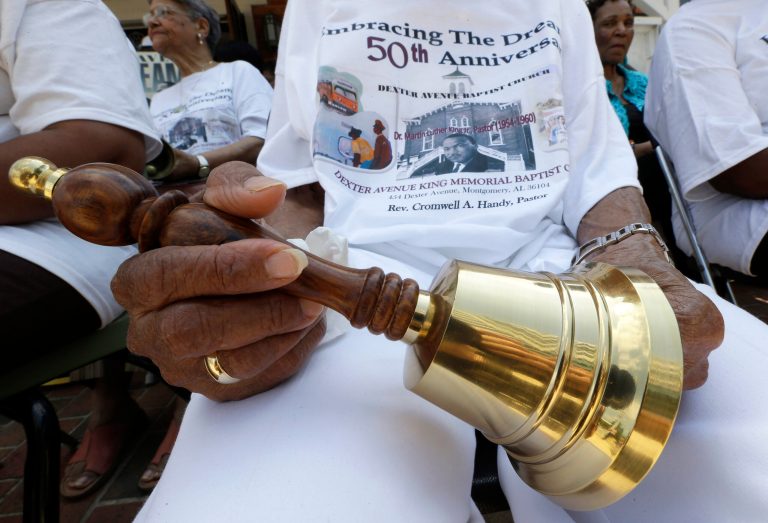   Jeanne Smiley of Montgomery, Ala., holds her bell during ceremonies honoring the 50th anniversary of the Martin Luther King Jr., 