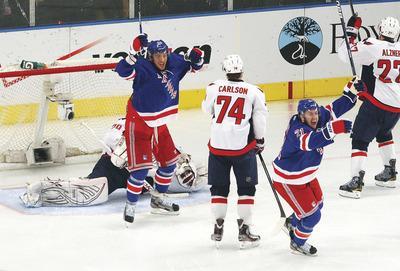 Bruce Bennett/Getty Images
The Rangers scored two goals in a two-minute span to steal a Game 5 win in New York on Monday night.