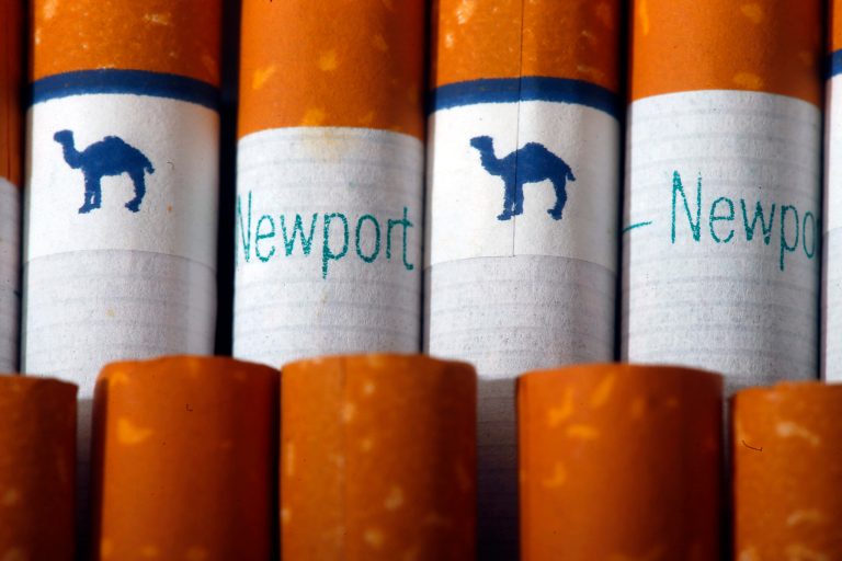 Camel, a Reynolds American brand, and Newport, a Lorillard brand, are arranged for a photo Tuesday, July 15, 2014 in Philadelphia. Reynolds American Inc. is planning to buy rival Lorillard Inc. for about $25 billion in a deal to combine two of the nation's oldest and biggest tobacco companies, the companies announced Tuesday. (AP Photo/Matt Rourke)