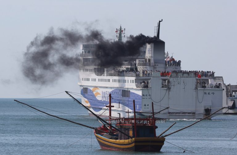 A ship carrying Chinese workers leaves Vung Ang port, Ha Tinh province, Vientam Monday, May 19, 2014.  Watched over by riot police, hundreds of Chinese workers left Vietnam on Monday on ships chartered by their government after deadly unrest broke out last week amid a dispute over sovereignty claims in the South China Sea. (AP Photo/Hau Dinh)