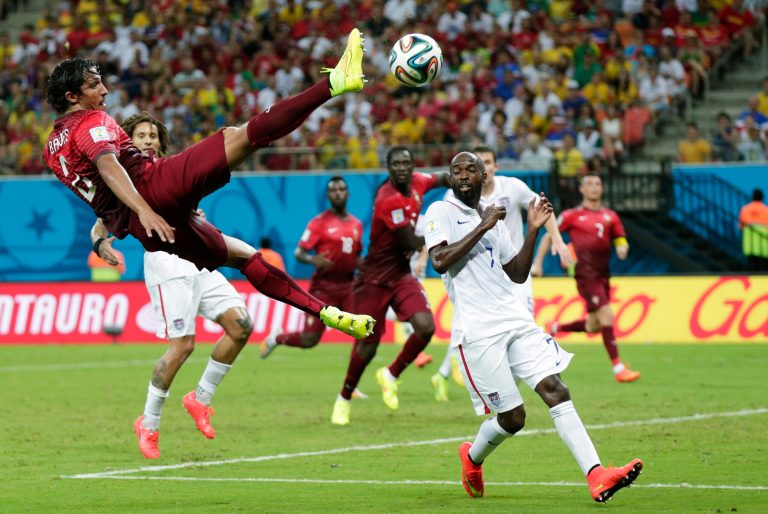FILE - In this June 22, 2014 file photo, Portugal's Bruno Alves kicks the ball above United States' DaMarcus Beasley, lower right, during the group G World Cup soccer match between the United States and Portugal at the Arena da Amazonia in Manaus, Brazil. For U.S. fans without cable television, there are more apps and options than ever to watch 
