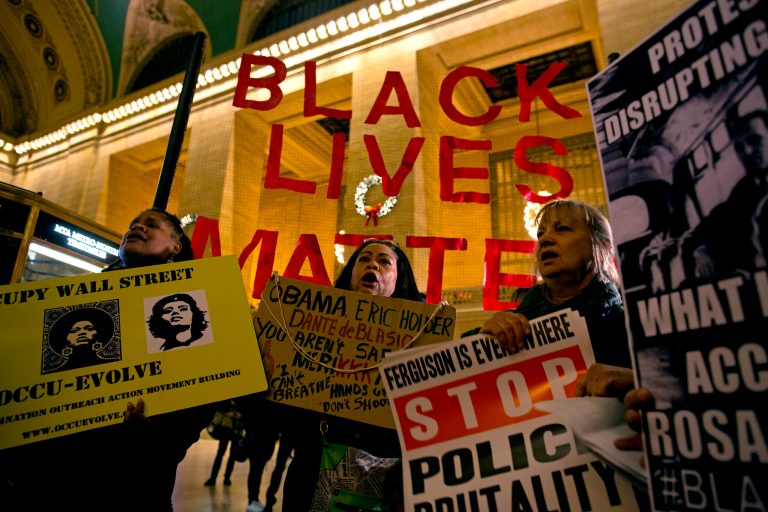 A group of protesters gather at Grand Central Terminal in New York, Thursday, Jan. 1, 2015. A number of protests have been staged around the country following recent grand jury decisions not to indict white police officers in New York and Ferguson, Mo., over the deaths of unarmed black men. (AP Photo/Craig Ruttle)