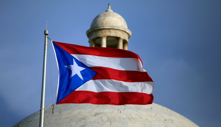Puerto Rico is undergoing a steady transformation that involves government right-sizing, reductions in public spending, a trimming of the number of political appointees, and a reformation of permitting processes. The government, led by new Governor Ricardo Rosselló, is also working on tax and energy reforms. (AP Photo/Ricardo Arduengo, File)