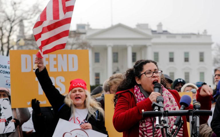 Celina Benitez protests in Lafayette Park, across from the White House in Washington, Monday, Jan. 8, 2018, in reaction to the announcement regarding Temporary Protective Status for people from El Salvador. The Trump administration is ending special protections for Salvadoran immigrants, forcing nearly 200,000 to leave the U.S. by September 2019 or face deportation. El Salvador is the fourth country whose citizens have lost Temporary Protected Status. (AP Photo/Pablo Martinez Monsivais)