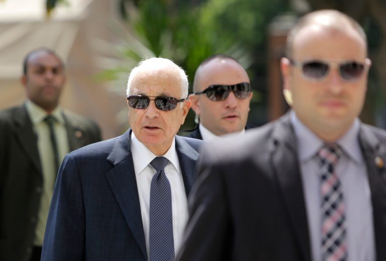 Egyptian bodyguards flank Arab League Secretary-General Nabil Elaraby, second left, upon his arrival at the league's headquarters in Cairo, Egypt, Egypt, Monday, Sept. 8, 2014. The Arab League says its member states have agreed to combat, either individually or collectively, the Islamic State group and other militants in the region. The resolution, issued Monday after late-night meetings a day earlier, doesn't explicitly back American military action against the group. U.S. President Barack Obama is seeking an international coalition to challenge the Islamic State group and is expected to outline his plan Wednesday. (AP Photo/Amr Nabil)