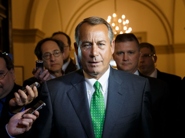 House Speaker John Boehner of Ohio is surrounded by reporters as he returns to the Capitol on Feb. 25 following a meeting at the White House with President Obama. (AP Photo/J. Scott Applewhite)