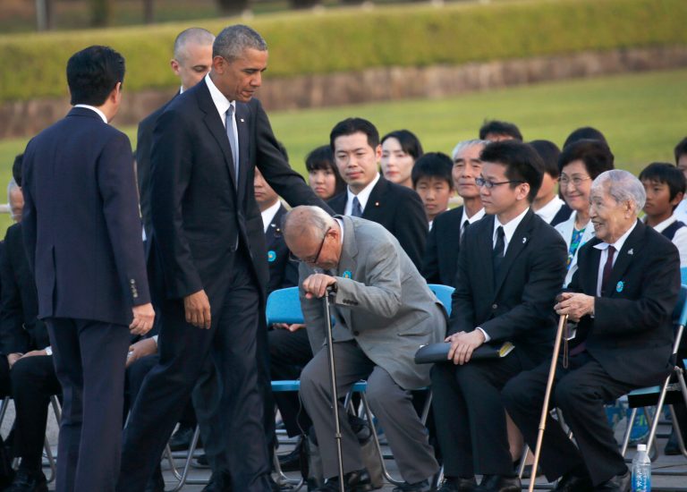 U.S. President Barack Obama, second from left, greets Shigeaki Mori, an atomic bomb survivor, third from right, and Sunao Tsuboi, right, chairman of Japan Confederation of A-and H-Bomb Sufferers Organizations, during a ceremony at Hiroshima Peace Memorial Park in Hiroshima. (AP Photo/Shuji Kajiyama)