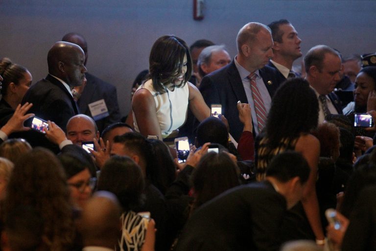 First Lady Michelle Obama greets guests after her keynote speech at the Unite For Veterans Summit in Los Angeles on Wednesday, July 16, 2014. The event was organized to discuss ways of providing opportunities for veterans to find employment and housing. (AP Photo/Nick Ut)