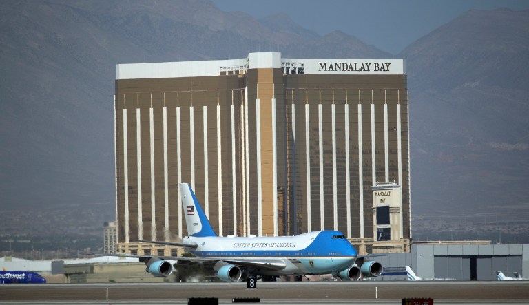 Trump's departure was captured in a stunning image, in which Air Force One can be seen taking off in full view of the Mandalay Bay hotel, the site where shooter Stephen Paddock took aim at concertgoers on the ground below. (AP Photo/John Locher)
