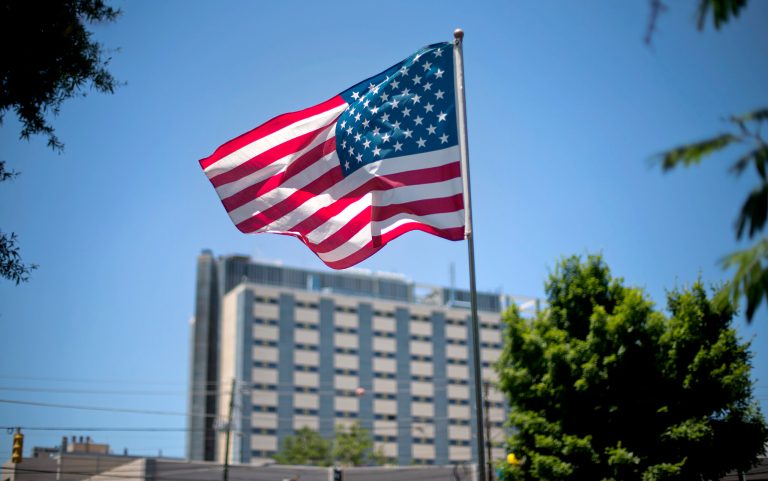 An American flag flies in front of the Atlanta VA Medical Center, Friday, May 24, 2013, in Atlanta. Four deaths at the Atlanta VA Medical Center are the latest in a series of problems plaguing the VA, prompting outrage from elected officials and congressional scrutiny of what is the largest integrated health care system in the country with nearly 300,000 employees. (AP Photo/David Goldman)