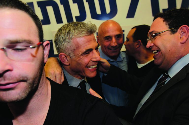 Yair Lapid celebrates with members of his 