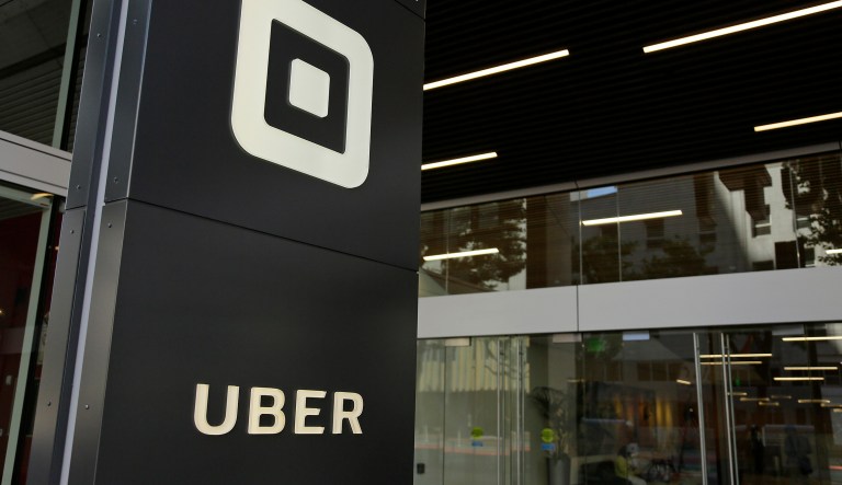 If British Uber drivers are legally defined as employees, Uber will have to pay them a $9.80/hour minimum wage, pay social security taxes, while also providing vacation and sick time. (AP Photo/Eric Risberg, File)