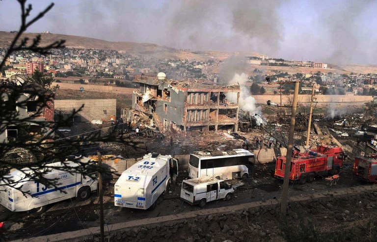 Kurdish militants attacked a police checkpoint in Cizre, southeast Turkey, Friday, with an explosives-laden truck, killing several police officers and wounding dozens more, according to reports. (DHA via AP)