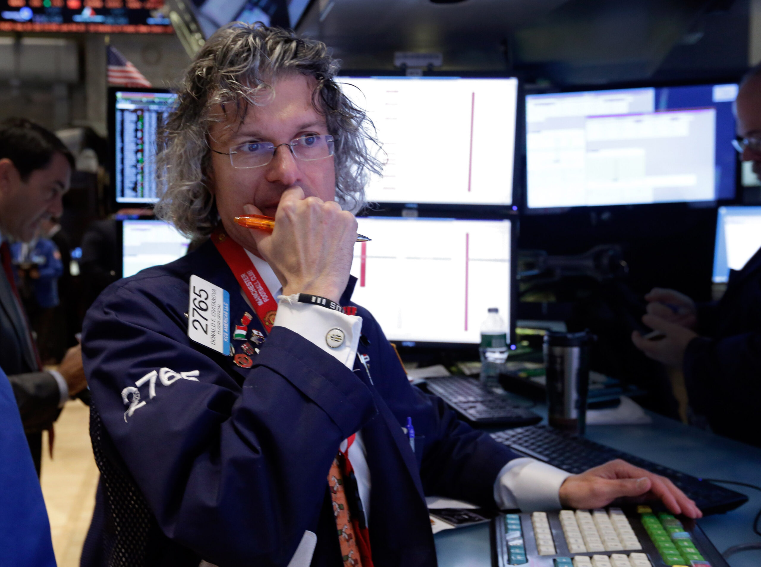 Stocks slide on weak earnings, Fed’s stimulus cuts