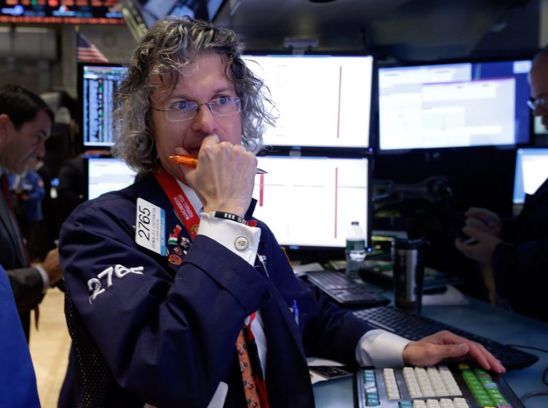 Specialist Donald Civitanova works on the floor of the New York Stock Exchange Wednesday, Jan. 29, 2014. Stocks are lower in early trading as weak earnings from several U.S. companies dented investors' confidence. Worries about emerging markets were also coming back after relief faded over an effort by Turkey to shore up its struggling currency. (AP Photo/Richard Drew)