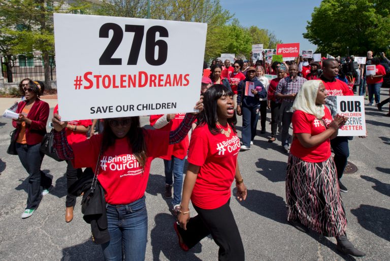 Protestors march in front of the Nigerian embassy in northwest Washington, Tuesday, May 6, 2014, protesting the kidnapping of nearly 300 teenage schoolgirls, abducted from a school in the remote northeast of Nigeria three weeks ago.   (AP Photo/Manuel Balce Ceneta)