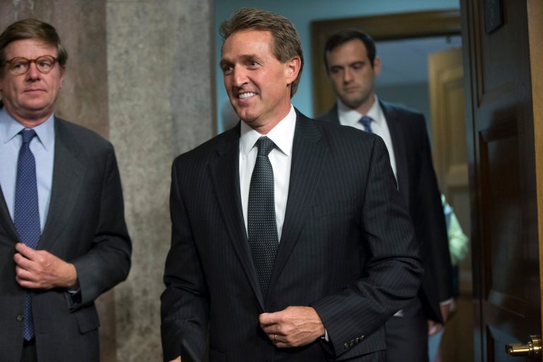 Sen. Jeff Flake, R-Ariz., arrives before Secretary of State John Kerry, Secretary of Energy Ernest Moniz, and Secretary of Treasury Jack Lew, arrive to testify at a Senate Foreign Relations Committee hearing on Capitol Hill, in Washington, Thursday, July 23, 2015, to review the Iran nuclear agreement. (AP Photo/Andrew Harnik)