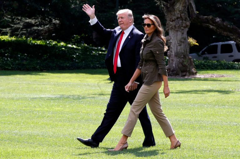 President Donald Trump waves while walking with first lady Melania Trump to the Marine One helicopter on the South Lawn of the White House, Friday, Sept. 15, 2017, in Washington, while en route to Andrews Air Force Base. (AP Photo/Jacquelyn Martin)