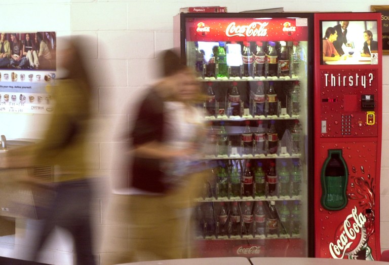 Students walks past a soda vending machine in the Commons Area of Springfield High School Wednesday, Jan. 28, 2004, in Springfield, Ill. (AP File)