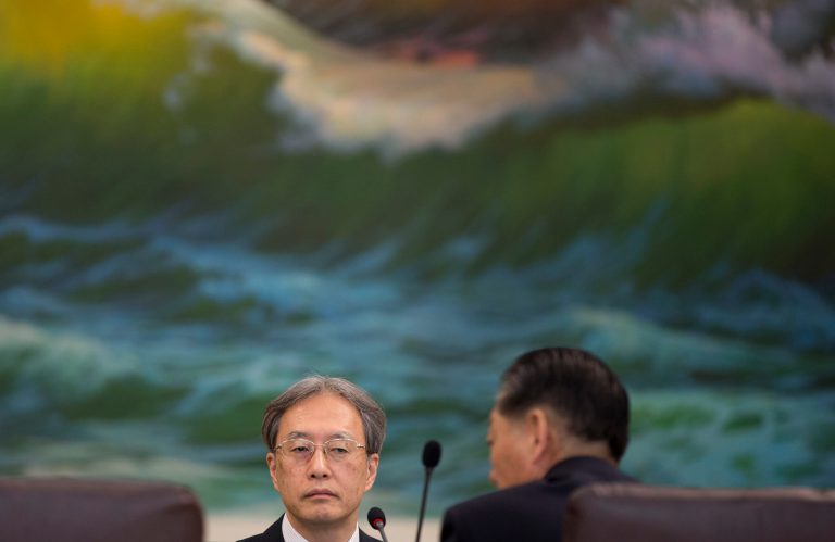 Junichi Ihara, head of the Japanese Foreign Ministry's Asia and Oceania Affairs Bureau, right, listens to Song Il Ho, North Korea's ambassador in charge of normalizing relations with Japan, right, during their meeting at the North Korean Embassy in Beijing, China Tuesday, July 1, 2014. (AP Photo/Andy Wong)