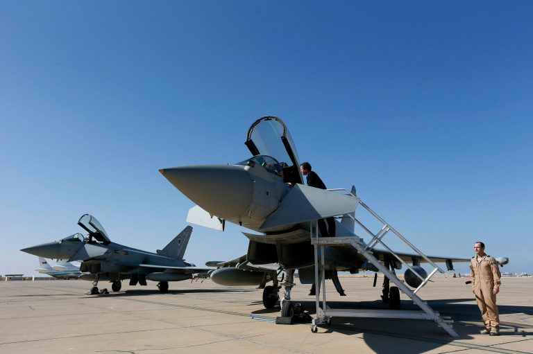   Britain's Prime Minister David Cameron looks into the cockpit of a Typhoon jet fighter during his visit to Muscat, Oman, Friday Dec. 21, 2012. It is announced Friday Dec. 21, 2012, that U.K. based aerospace and defence company BAE Systems has signed a 2.5 billion pound (US dlrs 4.1 billion/euro 3.1 billion) deal with Oman for 20 aircraft, including 12 Typhoon jets and eight Hawk aircraft. (AP Photo / Stefan Wermuth)  