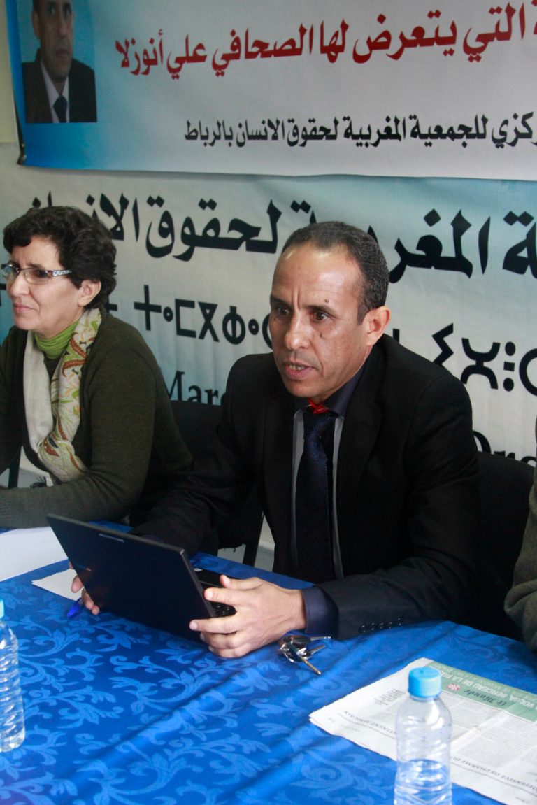 Sitting with Khadija Ryadi of the Moroccan Association for Human Rights, Moroccan editor Ali Anouzla, right, announces at a press conference in Rabat on Feb. 19, 2014 that he will launch another news website if authorities don't unblock his old one. Ali Anouzla, who was charged with advocating terrorism and aiding terrorists after his Lakome.com news site wrote about an al-Qaida video criticizing Morocco and its king, has kept a low profile since being freed on bail in October following a month in prison. (AP Photo/Paul Schemm)