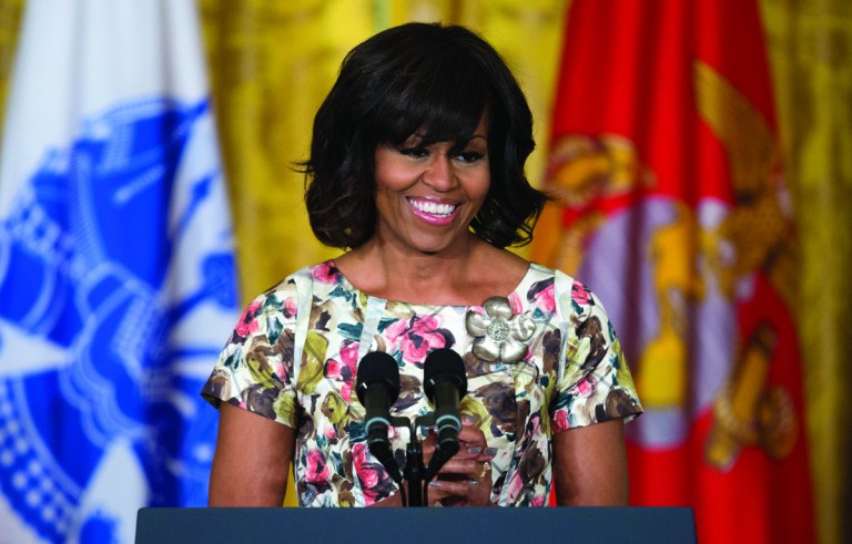 First lady Michelle Obama speaks in the East Room of the White House in Washington, Tuesday, April 30, 2013, during an event to promote hiring military veterans. (AP Photo/Evan Vucci)