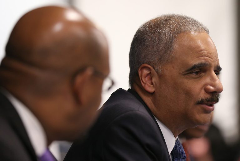 U.S. Attorney General Eric Holder participates in the Building Communities of Trust roundtable discussion in Philadelphia on Thursday, Jan. 15, 2015. (AP Photo/Philadelphia Inquirer, David Maialetti, Pool)