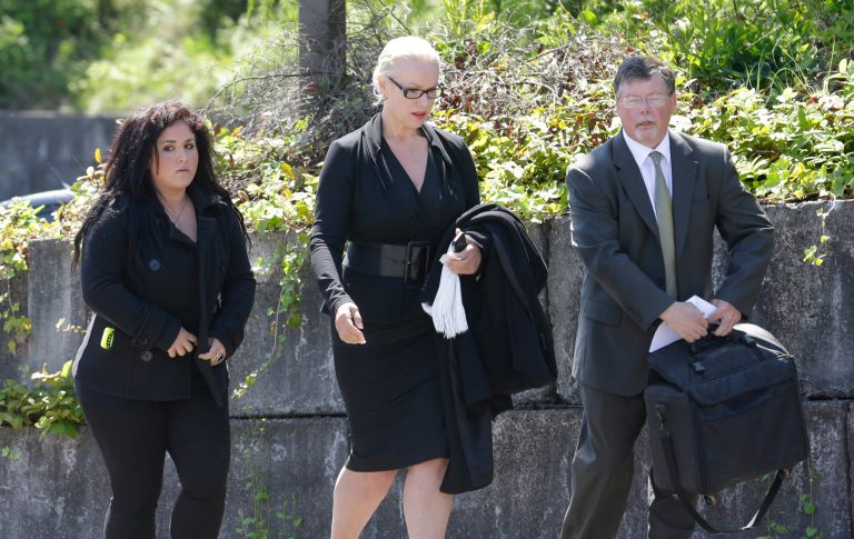 Jean Kasem, center, the wife of ailing radio personality Casey Kasem, walks with her daughter Liberty Kasem, left, and her attorney Steve Olsen, right, following a hearing in Kitsap County Superior Court, Friday, May 30, 2014 in Port Orchard, Wash. Jean Kasem was in court as part of an ongoing dispute with a stepdaughter who has been given authority to determine whether her father is receiving adequate medical care. Kasem and his wife have been staying with family friends in Washington state. (AP Photo/Ted S. Warren)