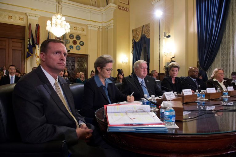 Diana Rubens (second left), and Kimberly Graves (third to the right) were accused of manipulating a VA program meant to ease the strain of relocating agency employees. (AP Photo/Molly Riley)
