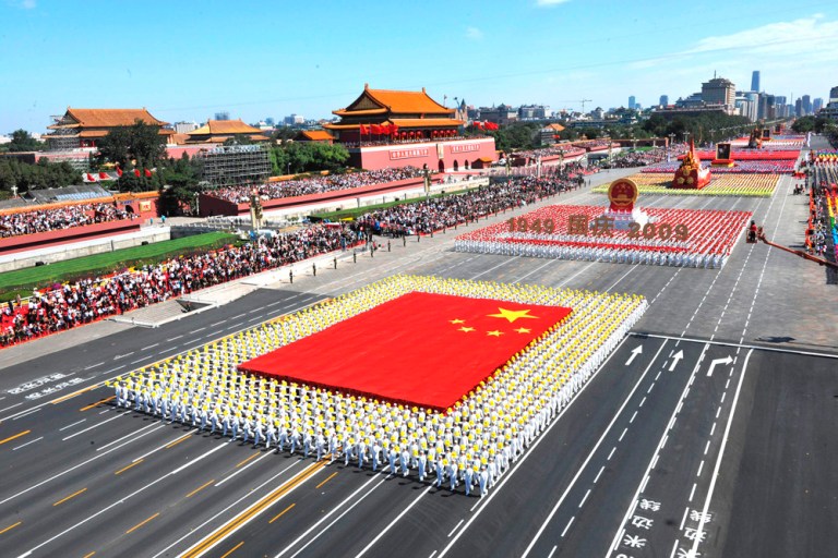The phalanx of national flag receives inspection in a parade in Beijing of the celebrations for the 60th anniversary of the founding of China on Oct. 1, 2009. (AP Photo/Xinhua, Huang Jingwen)