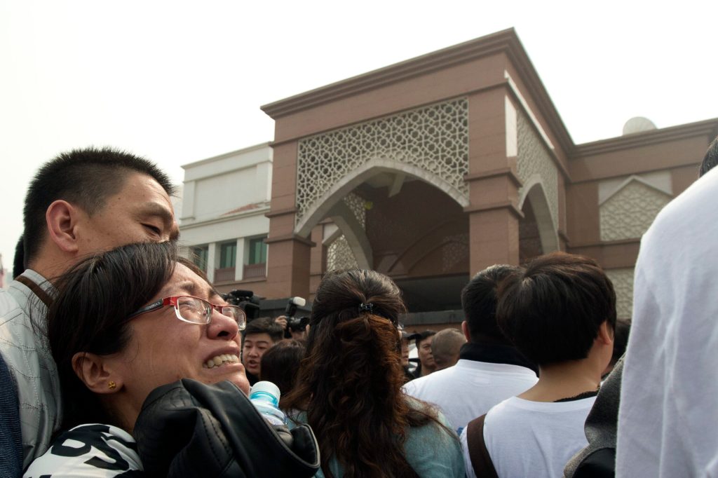 China in damage control over angry plane relatives