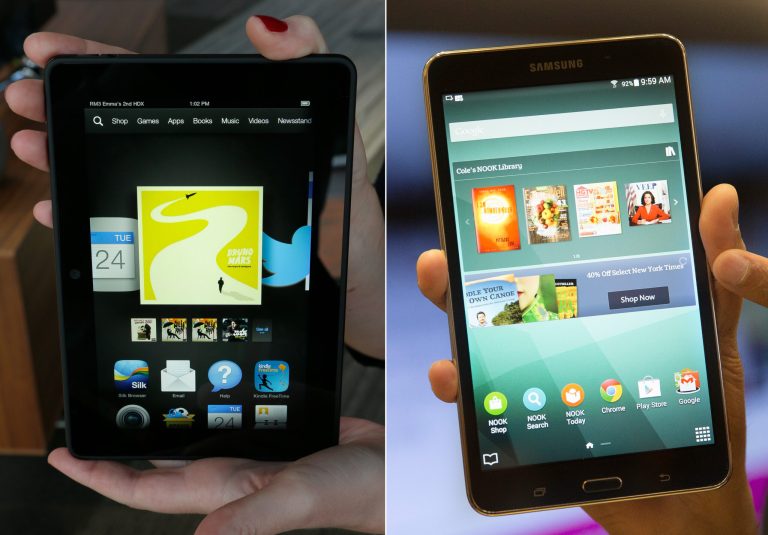 This combination of file photos shows the 7-inch Amazon Kindle HDX tablet, left, and the Samsung Galaxy Tab 4 Nook. (AP Photo/Ted S. Warren, John Minchillo, File)