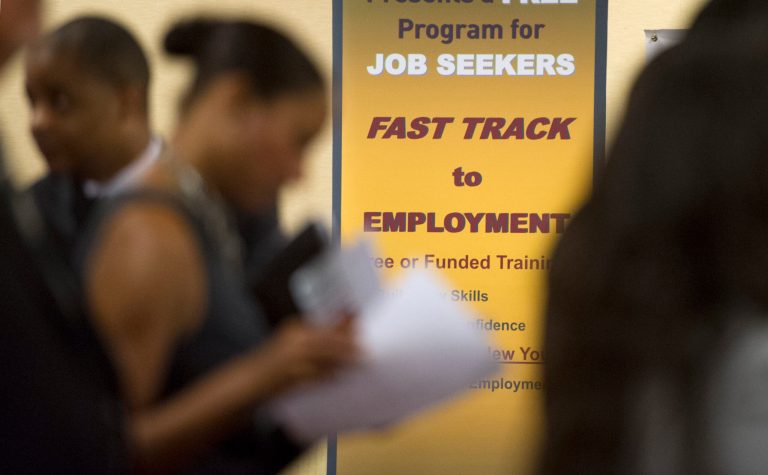 FILE - In this May 30, 2013, photo, job seekers line up to talk to recruiters during a job fair held in Atlanta.  The number of people seeking U.S. unemployment benefits dropped 12,000 to a seasonally adjusted 350,000 last week, though the total was elevated for the third straight week by technical problems in California. The Labor Department said Thursday, Oct. 24, 2013,  that the less volatile four-week average jumped by nearly 11,000 to 348,250. (AP Photo/John Amis, file)