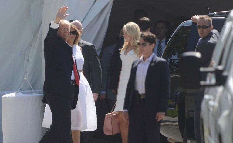 President Donald Trump, accompanied by first lady Melania Trump waves to onlookers as he enters Episcopal Church of Bethesda-by-the-Sea in Palm Beach, Fla., for an Easter Service, Sunday, April 16, 2017. (Joe Cavaretta/South Florida Sun-Sentinel via AP)