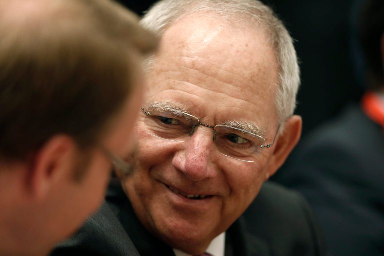 German Finance Minister Wolfgang Schaeuble chats during a European Finance ministers meeting at Zappeion Hall in Athens, on Wednesday, April 2, 2014. Greece will tap bond markets in the next three months for the first time since it needed international rescue loans in 2010, the finance minister said Tuesday, hours after fellow eurozone countries agreed to release more bailout funds. (AP Photo/Petros Giannakouris)