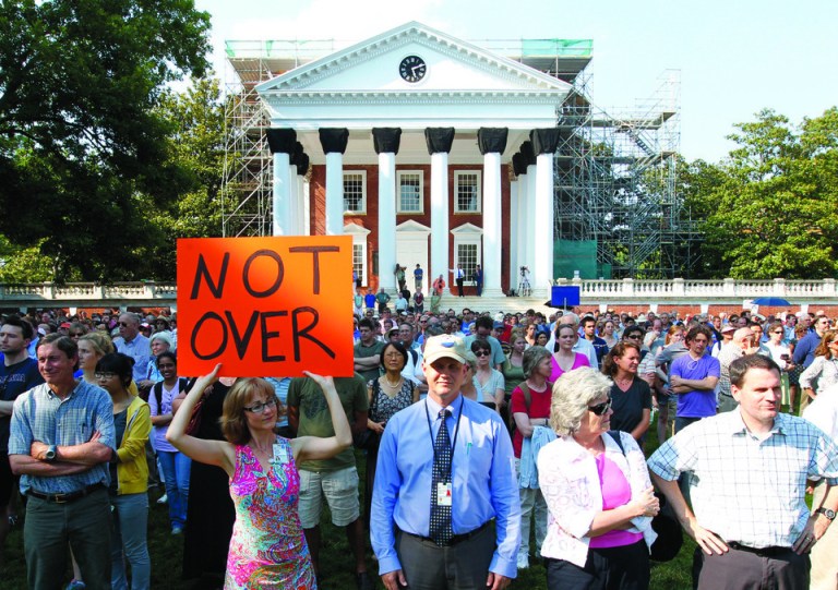 Hundreds gather in front of the Rotunda for a silent vigil in support of the reinstatement of ousted University of Virginia President Teresa Sullivan, Wednesday, June 20, 2012. The Faculty Senate continued its efforts to get the Board of Visitors to reinstate the popular Sullivan. (AP Photo/The Daily Progress, Sabrina Schaeffer)